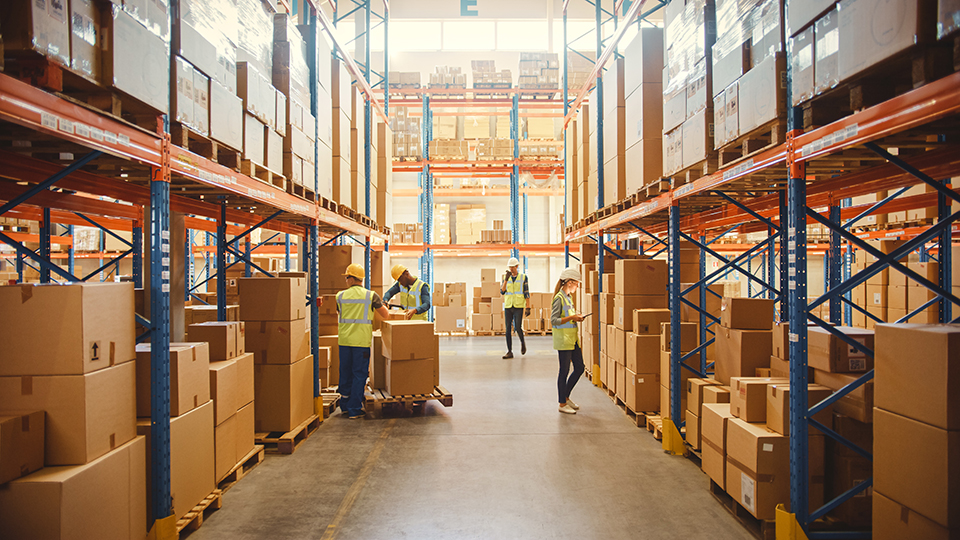 Warehouse Employees Working In Aisle - Leaman Container, Inc.