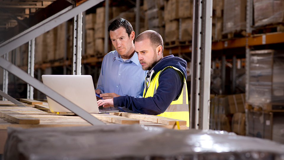 Workers Checking Warehouse Inventory - Leaman Container, Inc.